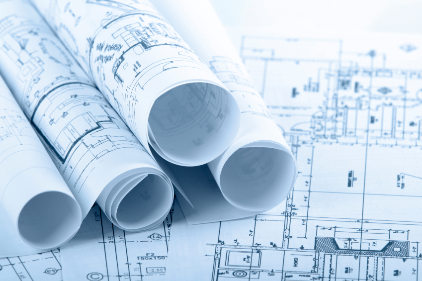 pile of spread and roled up architectural blueprints